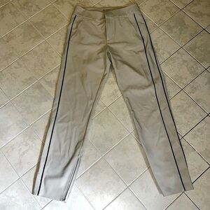 Athleta beige trousers with black pinstripe down sides. A little cropped-ankle